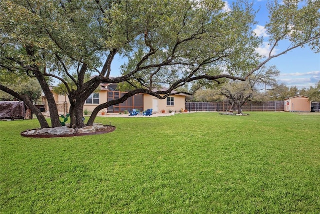 view of yard with an outdoor structure and a storage shed
