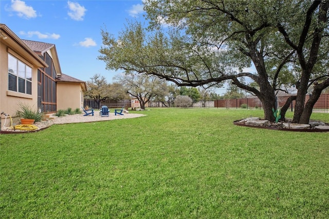 view of yard with a patio and fence