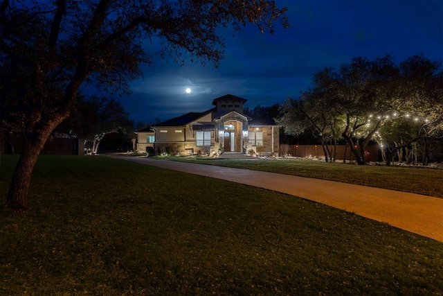 view of front of home featuring a yard and concrete driveway