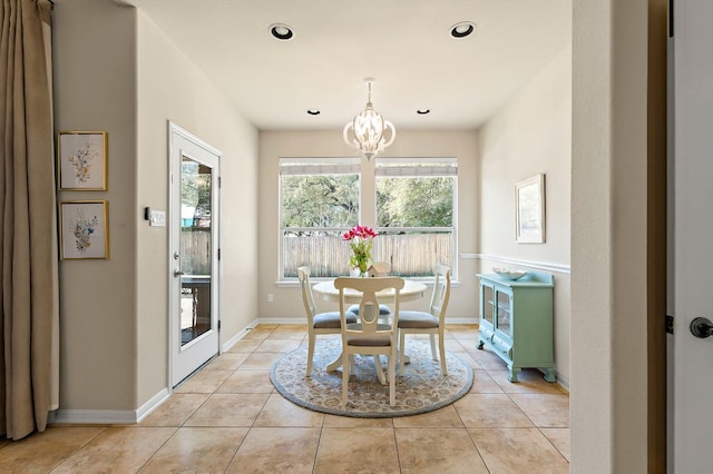 dining space featuring recessed lighting, baseboards, an inviting chandelier, and light tile patterned flooring