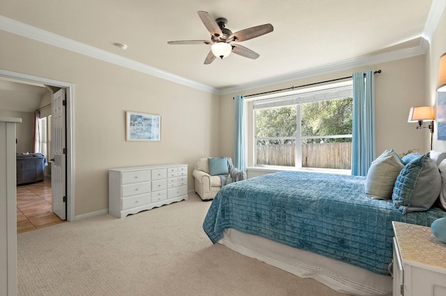 bedroom featuring a ceiling fan, crown molding, carpet, and baseboards