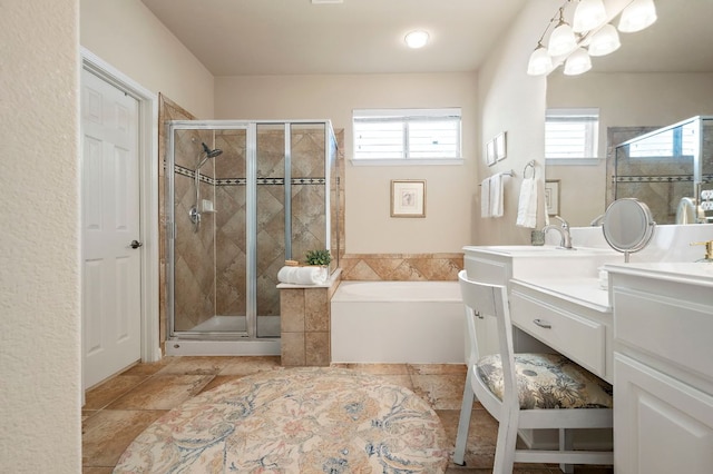 full bathroom with a bath, a shower stall, and vanity