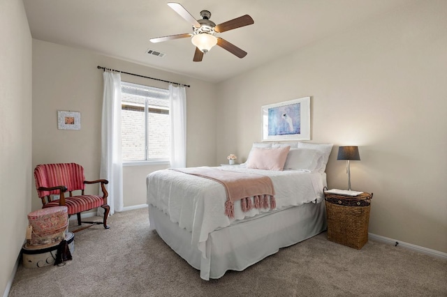 carpeted bedroom with baseboards, visible vents, and ceiling fan