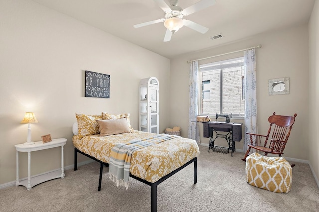 carpeted bedroom featuring a ceiling fan, baseboards, and visible vents