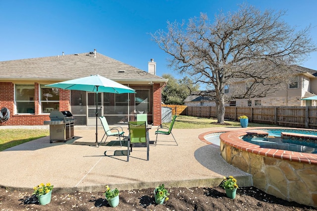 view of patio featuring area for grilling, an in ground hot tub, a fenced backyard, and a sunroom