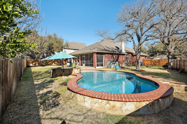 view of swimming pool with a fenced in pool, a fenced backyard, a lawn, and a sunroom