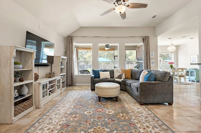 living area with vaulted ceiling, ceiling fan with notable chandelier, visible vents, and a wealth of natural light