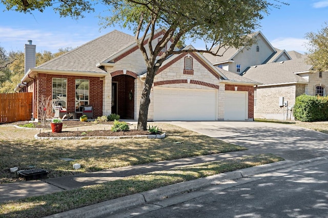 view of front of property featuring brick siding, fence, concrete driveway, a chimney, and a garage