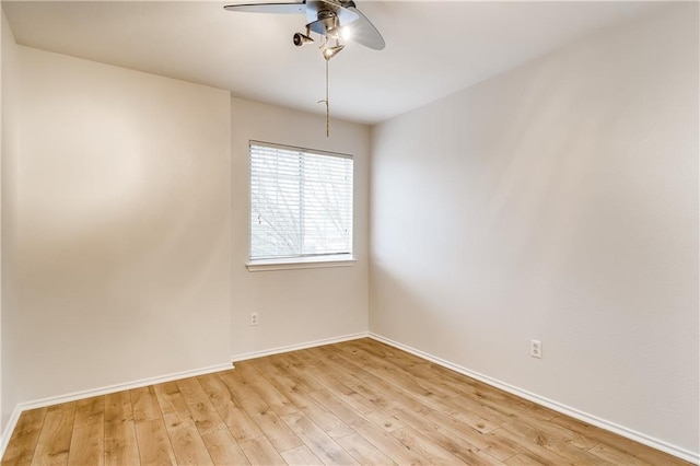 unfurnished room with light wood-style flooring, baseboards, and ceiling fan