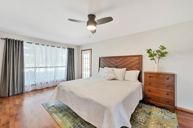 bedroom with wood finished floors and a ceiling fan