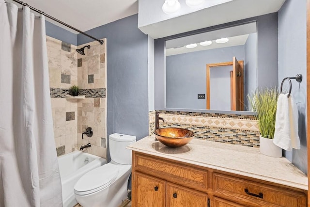 bathroom with tasteful backsplash, toilet, vanity, and shower / bathtub combination with curtain