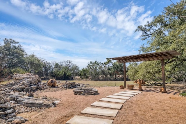 view of yard featuring an outdoor fire pit