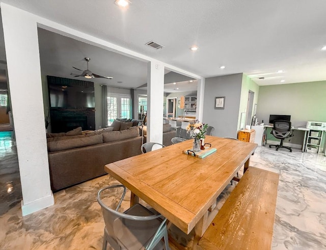 dining space with recessed lighting, a fireplace, visible vents, ceiling fan, and marble finish floor