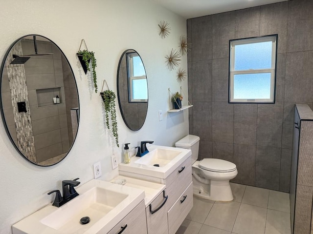 full bathroom with a sink, toilet, and a healthy amount of sunlight