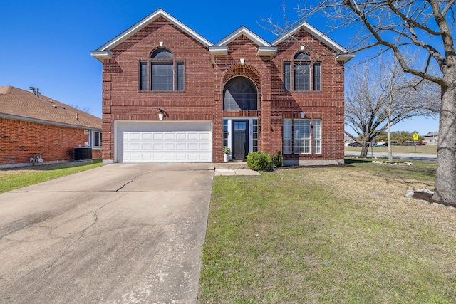 traditional-style home with brick siding, an attached garage, concrete driveway, and a front lawn