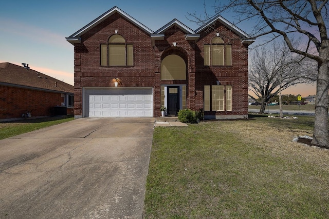 traditional-style home with a garage, brick siding, concrete driveway, and a front lawn