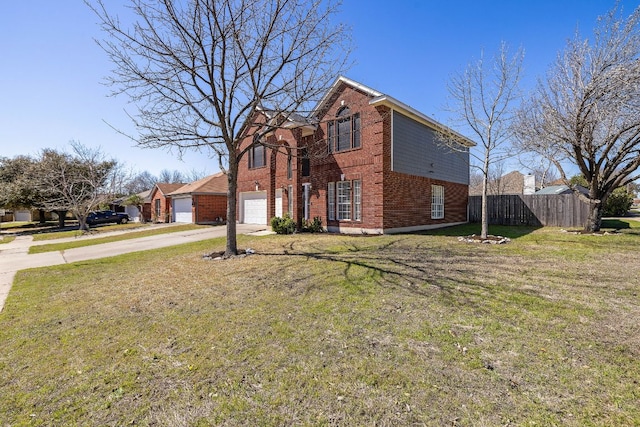 traditional-style house featuring brick siding, concrete driveway, a front yard, and fence