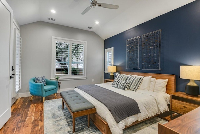 bedroom featuring lofted ceiling, wood finished floors, and visible vents