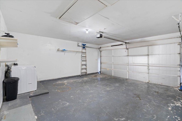 garage featuring washer / clothes dryer and a garage door opener