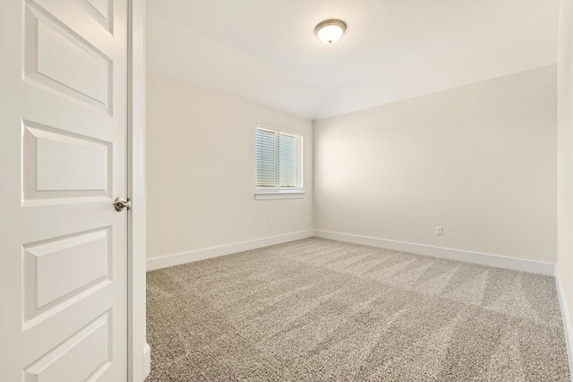 spare room with carpet flooring and baseboards