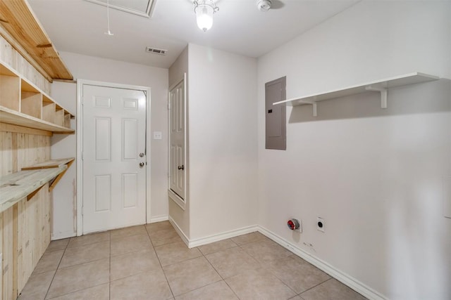 washroom featuring visible vents, attic access, electric panel, laundry area, and light tile patterned floors