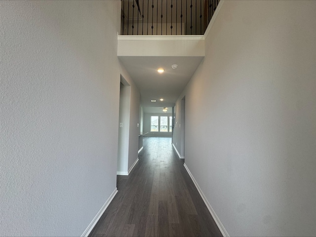 191 Dove Tree Dr, Buda, TX 78610 - hallway featuring baseboards and dark wood finished floors
