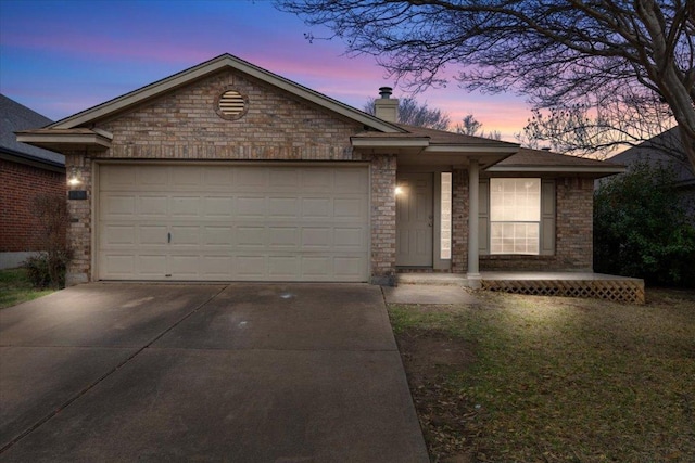 ranch-style home with a garage, brick siding, concrete driveway, and a chimney