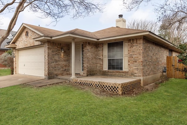 single story home featuring brick siding, an attached garage, and a front yard