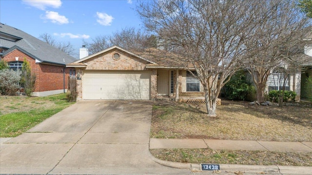 ranch-style home featuring brick siding, concrete driveway, and a garage