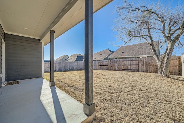 view of yard featuring a patio area and a fenced backyard