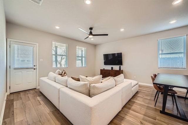 living room with recessed lighting, baseboards, light wood-style flooring, and a ceiling fan