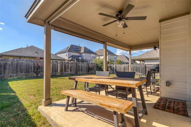 view of patio with ceiling fan, a fenced backyard, and outdoor dining space