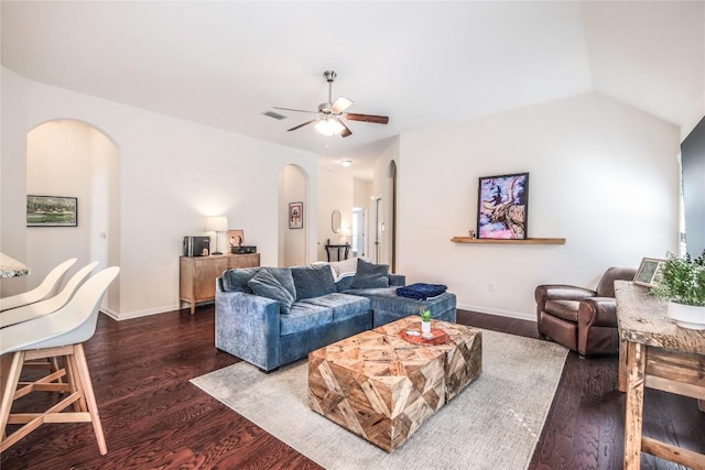 living area with visible vents, lofted ceiling, wood finished floors, arched walkways, and a ceiling fan