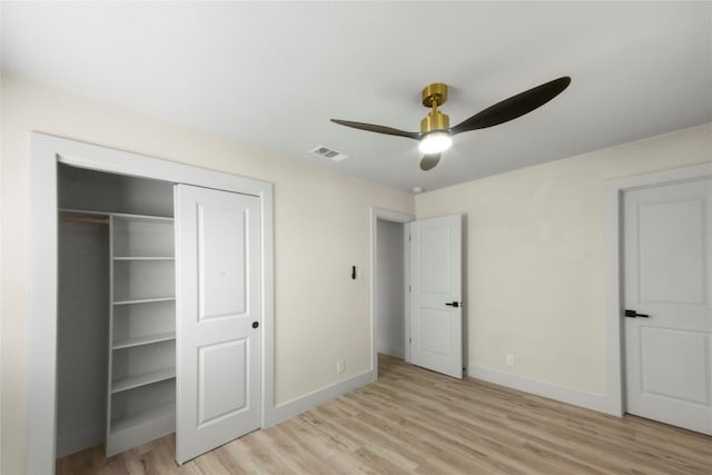 unfurnished bedroom with visible vents, baseboards, and light wood-style floors