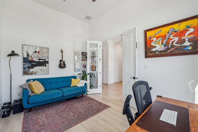 office featuring wood finished floors and french doors