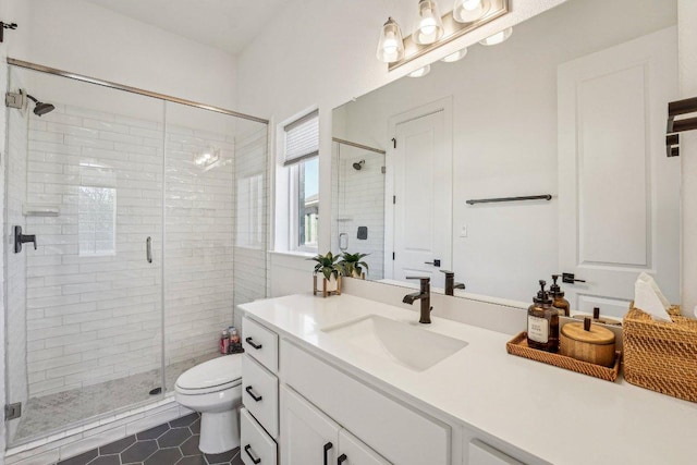 full bathroom featuring tile patterned floors, toilet, a stall shower, and vanity