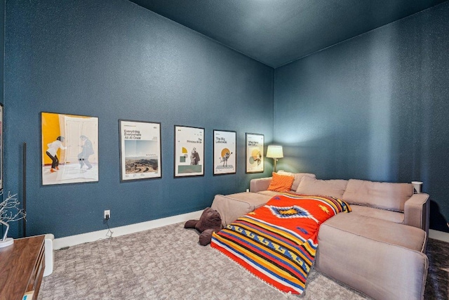 carpeted bedroom featuring baseboards