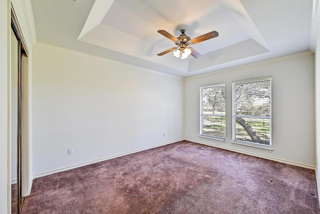 410 Rolling Green Dr, Lakeway, TX 78734 - carpeted empty room with a raised ceiling, ceiling fan, baseboards, and ornamental molding