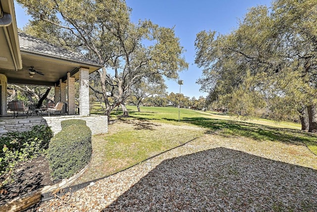 410 Rolling Green Dr, Lakeway, TX 78734 - view of grassy yard featuring a ceiling fan and a patio