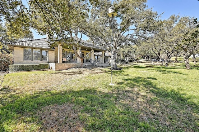 410 Rolling Green Dr, Lakeway, TX 78734 - view of front of home with a front lawn and a porch