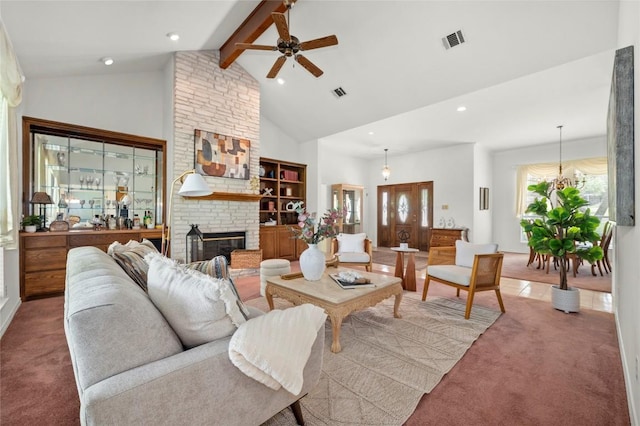 410 Rolling Green Dr, Lakeway, TX 78734 - living room featuring carpet floors, ceiling fan, beamed ceiling, a fireplace, and high vaulted ceiling