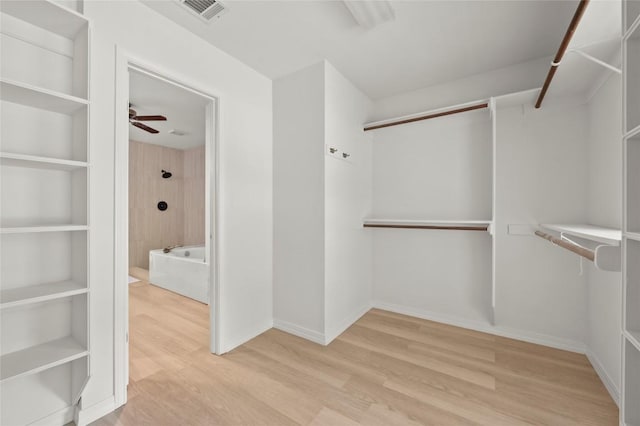 410 Rolling Green Dr, Lakeway, TX 78734 - spacious closet with wood finished floors and a ceiling fan