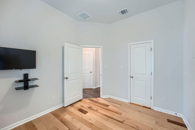 107 Lemuel Crawford Trl, Bastrop, TX 78602 - unfurnished bedroom featuring light wood-style floors and baseboards