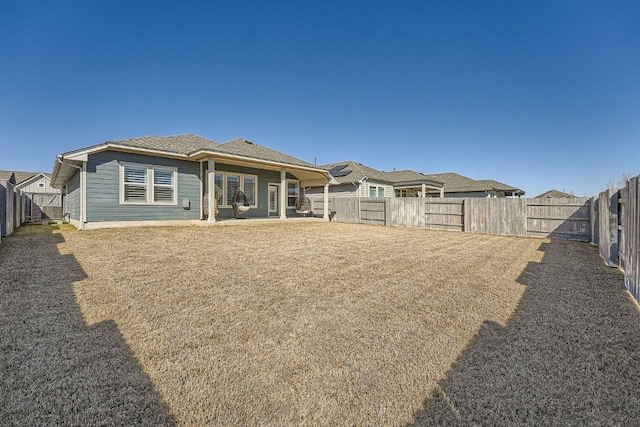 107 Lemuel Crawford Trl, Bastrop, TX 78602 - rear view of house with a fenced backyard