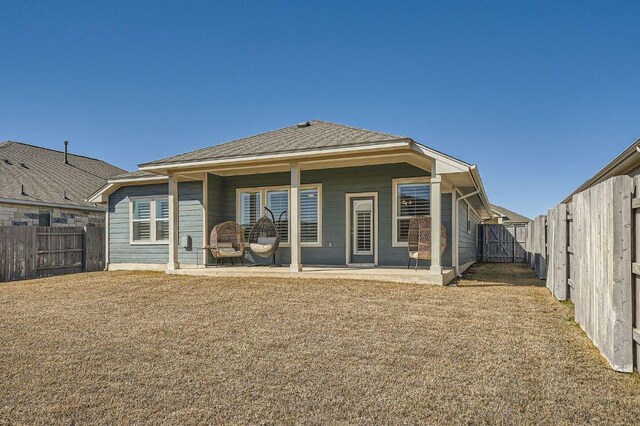 107 Lemuel Crawford Trl, Bastrop, TX 78602 - back of property with a fenced backyard and a patio