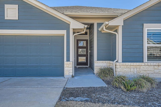 107 Lemuel Crawford Trl, Bastrop, TX 78602 - doorway to property with a garage, stone siding, and concrete driveway