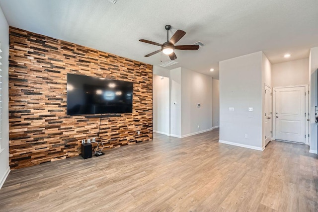 107 Lemuel Crawford Trl, Bastrop, TX 78602 - unfurnished living room with ceiling fan, wood finished floors, and recessed lighting