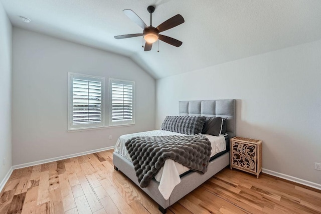 107 Lemuel Crawford Trl, Bastrop, TX 78602 - bedroom featuring lofted ceiling, light wood-style floors, baseboards, and ceiling fan