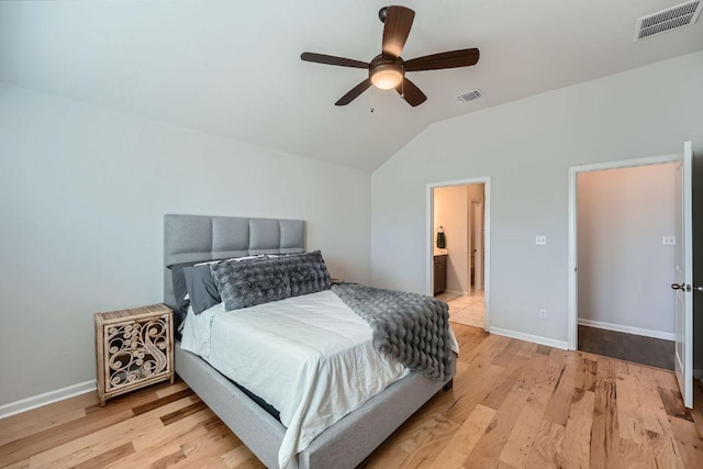107 Lemuel Crawford Trl, Bastrop, TX 78602 - bedroom with vaulted ceiling, light wood-type flooring, baseboards, and ceiling fan
