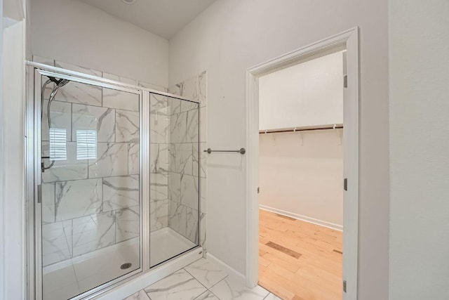 107 Lemuel Crawford Trl, Bastrop, TX 78602 - full bath with a marble finish shower, a walk in closet, and marble finish floors